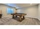 Recreational room features a classic pool table with wooden accents and space for entertainment at 9574 Keystone Trl, Parker, CO 80134