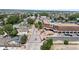 Aerial view captures Parker's main street lined with buildings, trees, and pedestrian-friendly walkways at 10814 Bayfield Way, Parker, CO 80138