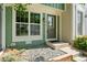 Inviting front entryway featuring stone ground cover and attractive exterior paint at 10814 Bayfield Way, Parker, CO 80138