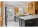 Modern kitchen featuring an island, tile flooring, and stainless steel appliances at 10814 Bayfield Way, Parker, CO 80138