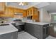 Modern kitchen featuring an island, tile flooring, and stainless steel appliances at 10814 Bayfield Way, Parker, CO 80138