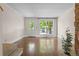 Bright living room featuring hardwood floors, a staircase and a view of the yard at 10814 Bayfield Way, Parker, CO 80138