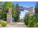 Welcome to O'Brien Park, Downtown Parker's stone archway entrance amidst trees & a playground at 10814 Bayfield Way, Parker, CO 80138