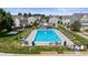 Community pool with lounge chairs, tables, and landscaped area at 10814 Bayfield Way, Parker, CO 80138