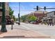 Street view with a charming atmosphere, featuring various shops, restaurants, and pedestrian-friendly sidewalks at 10814 Bayfield Way, Parker, CO 80138