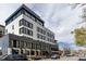 Modern building exterior showcasing multiple floors with dining and retail options at 3330 E 4Th Ave, Denver, CO 80206