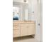 Bathroom with a floating vanity, large mirror, and tile flooring at 99 S Albion St, Denver, CO 80246