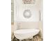 Modern bathtub with pebble base and a chandelier at 99 S Albion St, Denver, CO 80246