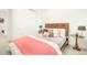Bright bedroom with a wooden headboard, sliding closet, and side tables at 99 S Albion St, Denver, CO 80246
