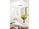 Bright breakfast nook with a built-in bench, table, chairs, and a view of the outdoors at 99 S Albion St, Denver, CO 80246
