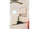 A kitchenette with light wood cabinets, black tile floors, and stainless steel appliances at 99 S Albion St, Denver, CO 80246