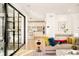 Bright living room featuring access to the kitchen and an expansive sliding glass door at 99 S Albion St, Denver, CO 80246