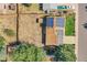 Aerial view of property showing roof with solar panels, backyard and proximity to neighboring homes at 5183 Durham Ct, Denver, CO 80239