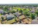 Aerial view of backyard showing fence, trees and proximity to the park and recreational facilities at 5183 Durham Ct, Denver, CO 80239