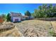 Large backyard with a storage shed, wooden fence and ample space for recreation at 5183 Durham Ct, Denver, CO 80239