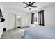Bedroom with a ceiling fan, window with curtains, carpet flooring, and a mirror at 5183 Durham Ct, Denver, CO 80239