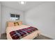 Cozy bedroom with neutral walls, plush bedding, a window, and carpeted flooring at 5183 Durham Ct, Denver, CO 80239