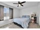 Bright bedroom features a large window and a plush, comfy bed at 5183 Durham Ct, Denver, CO 80239