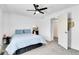 Bright bedroom with a ceiling fan, a comfortable bed, and a doorway leading to a closet at 5183 Durham Ct, Denver, CO 80239