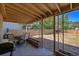 Inviting covered patio area with outdoor seating and a view of the backyard at 5183 Durham Ct, Denver, CO 80239