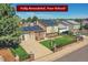 Charming home with solar panels, manicured lawn, and a delightful fenced front yard at 5183 Durham Ct, Denver, CO 80239