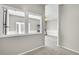 Bright hallway with fresh paint and new carpet leading to a cozy room at 5183 Durham Ct, Denver, CO 80239