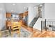 Inviting kitchen with wood cabinets, stainless steel appliances, and a cozy dining area at 5183 Durham Ct, Denver, CO 80239