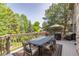 Inviting outdoor deck with dining table and chairs, perfect for entertaining or relaxing with scenic views at 9 Roder Gate Ln, Castle Pines, CO 80108