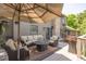 Enjoy outdoor living on this spacious deck with comfortable seating, fire pit, and umbrella, ideal for relaxation at 9 Roder Gate Ln, Castle Pines, CO 80108