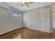 Bright bedroom with hardwood floors, a ceiling fan, natural light and closet space at 1355 Gaylord St # 6, Denver, CO 80206