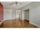 Light-filled bedroom boasts hardwood floors, closet storage, a ceiling fan and convenient access to an en-suite bathroom at 1355 Gaylord St # 6, Denver, CO 80206