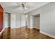 Spacious bedroom with hardwood floors, offering closet storage, and an en-suite bathroom entrance at 1355 Gaylord St # 6, Denver, CO 80206