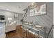 Cozy dining area with stylish lighting and decor next to the staircase at 1355 Gaylord St # 6, Denver, CO 80206