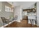 Dining space adjacent to the kitchen boasts hardwood floors and modern design at 1355 Gaylord St # 6, Denver, CO 80206