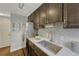 Well-lit kitchen features stainless steel appliances, sleek countertops, and stylish backsplash at 1355 Gaylord St # 6, Denver, CO 80206
