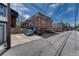 Exterior shot of parking lot with a view of the multi-Gathering building at 1355 Gaylord St # 6, Denver, CO 80206