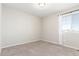 Neutral bedroom with carpet, a large window with curtains, and ample natural light at 22921 E Union Ave, Aurora, CO 80015