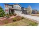Beautiful two story home with gray siding, red shutters and landscaped front yard at 22921 E Union Ave, Aurora, CO 80015
