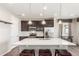 Modern kitchen featuring stainless steel appliances, a large island and bar stool seating at 22921 E Union Ave, Aurora, CO 80015