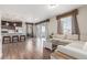 Bright, open-concept living room featuring wood floors, modern decor, and a seamless flow to the kitchen at 22921 E Union Ave, Aurora, CO 80015