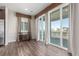 Bright room with sliding glass doors to the patio, hardwood floors, and stylish furnishings at 22921 E Union Ave, Aurora, CO 80015