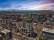 Scenic aerial view of luxurious high-rise buildings at sunset, showcasing the surrounding cityscape and mountain backdrop at 975 N Lincoln St # 3H, Denver, CO 80203