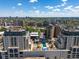 Capture the building's beautiful roof-top amenities, including the pool, against a backdrop of blue skies and urban sprawl at 975 N Lincoln St # 3H, Denver, CO 80203
