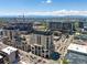Scenic aerial view of luxurious high-rise buildings, showcasing the surrounding cityscape and mountain backdrop at 975 N Lincoln St # 3H, Denver, CO 80203