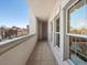 Bright balcony featuring a view of the city, enhanced by expansive windows offering natural light to the interior spaces at 975 N Lincoln St # 3H, Denver, CO 80203