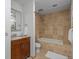 Bathroom featuring a tub with shower and beautiful wooden vanity at 975 N Lincoln St # 3H, Denver, CO 80203