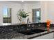 Well-appointed kitchen showcasing elegant granite countertops, a modern faucet, and stylish decor at 975 N Lincoln St # 3H, Denver, CO 80203