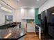 Spacious kitchen with stainless steel appliances and tiled backsplash at 975 N Lincoln St # 3H, Denver, CO 80203