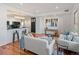Inviting living space features a modern kitchen with breakfast bar seating and comfortable sofas at 975 N Lincoln St # 3H, Denver, CO 80203