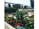 Beautiful outdoor landscape featuring lush greenery, colorful flowers, and serene seating areas at 975 N Lincoln St # 3H, Denver, CO 80203